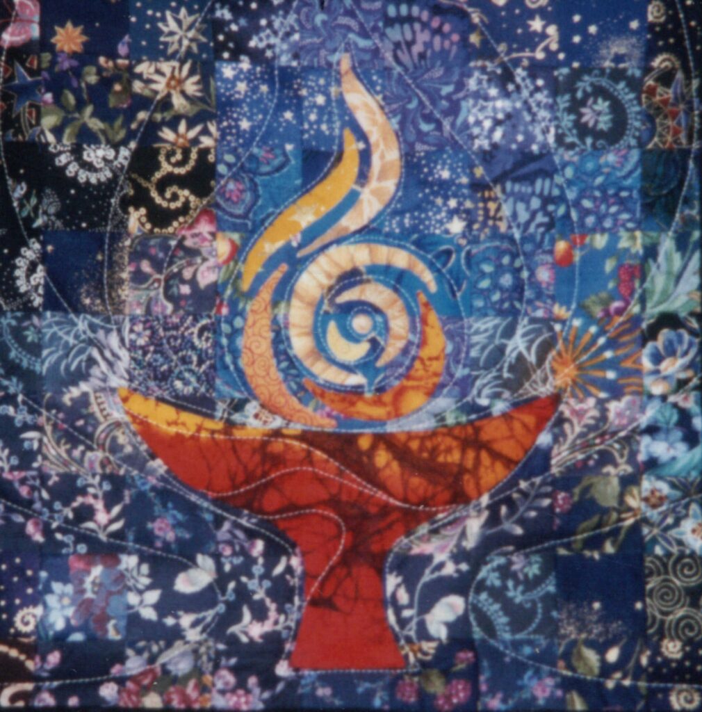 A colorful quilt-like UU Wellspring chalice