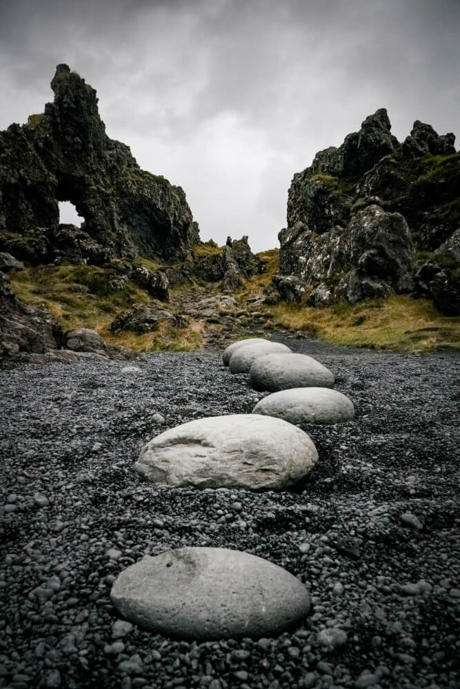 Smooth stones making a path into the wilderness.
